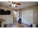 Secondary bedroom with large closet and ceiling fan at 4539 W Mclellan Rd, Glendale, AZ 85301