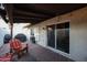 Covered patio with brick flooring and space for grilling at 4539 W Mclellan Rd, Glendale, AZ 85301