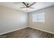 Bright bedroom with ceiling fan, vinyl flooring, and window coverings at 4565 N 26Th Dr, Phoenix, AZ 85017