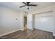 Spacious bedroom with ceiling fan, large closet, and loft access at 4565 N 26Th Dr, Phoenix, AZ 85017