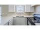 Updated kitchen featuring white shaker cabinets and stainless steel sink at 4565 N 26Th Dr, Phoenix, AZ 85017