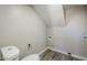 Compact laundry area with toilet and vinyl flooring at 4565 N 26Th Dr, Phoenix, AZ 85017