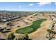 Aerial view of a golf course community with mountain views at 4655 E Indigo St, Gilbert, AZ 85298