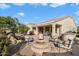 Fire pit and seating area on a spacious flagstone patio at 4655 E Indigo St, Gilbert, AZ 85298