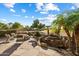 Landscaped backyard with fire pit, water feature, and plenty of seating at 4655 E Indigo St, Gilbert, AZ 85298