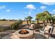 Fire pit area with seating and stunning golf course views at 4655 E Indigo St, Gilbert, AZ 85298