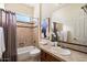 Well-appointed bathroom includes a bathtub, toilet, and vanity with ample storage at 4655 E Indigo St, Gilbert, AZ 85298