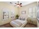 Cozy bedroom with a comfortable bed, neutral decor, and large windows at 4655 E Indigo St, Gilbert, AZ 85298