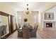 Formal dining room with chandelier and fireplace view at 4655 E Indigo St, Gilbert, AZ 85298