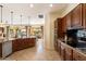 Kitchen with large island, stainless steel appliances and wood cabinets at 4655 E Indigo St, Gilbert, AZ 85298