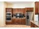 Kitchen with stainless steel appliances and wood cabinets at 4655 E Indigo St, Gilbert, AZ 85298