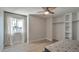 Cozy bedroom with large window and built-in shelving at 4818 E Dartmouth Cir, Mesa, AZ 85205