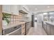 Modern kitchen with patterned backsplash and stainless steel appliances at 4818 E Dartmouth Cir, Mesa, AZ 85205