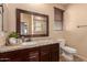 Bathroom with granite countertop and large mirror at 494 S 220Th Ln, Buckeye, AZ 85326