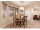 Bright breakfast nook features a round table with four chairs at 494 S 220Th Ln, Buckeye, AZ 85326