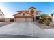 Two-story house with three-car garage and landscaped yard at 494 S 220Th Ln, Buckeye, AZ 85326