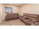 Relaxing sitting area with two reclining sofas at 494 S 220Th Ln, Buckeye, AZ 85326