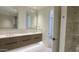 Modern bathroom with double vanity and walk-in shower at 5000 E Camelback Ridge Rd # 301, Scottsdale, AZ 85251