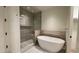 Elegant bathroom featuring a soaking tub and shower at 5000 E Camelback Ridge Rd # 301, Scottsdale, AZ 85251