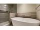 Bathroom with soaking tub and walk-in shower at 5000 E Camelback Ridge Rd # 301, Scottsdale, AZ 85251