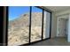 Bedroom with expansive windows showcasing breathtaking mountain views at 5000 E Camelback Ridge Rd # 301, Scottsdale, AZ 85251