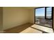 Bright bedroom with hardwood floors and large window at 5000 E Camelback Ridge Rd # 301, Scottsdale, AZ 85251