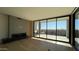 Living room with fireplace and sliding doors to balcony at 5000 E Camelback Ridge Rd # 301, Scottsdale, AZ 85251