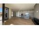 Open concept living room with kitchen and balcony access at 5000 E Camelback Ridge Rd # 301, Scottsdale, AZ 85251