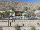 Community pool and spa surrounded by desert landscaping and mountain backdrop at 5000 N Camelback Ridge Dr # 301, Scottsdale, AZ 85251