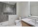 Modern bathroom featuring a glass shower with gray tiling and a sleek, illuminated mirror at 5000 N Camelback Ridge Dr # 301, Scottsdale, AZ 85251