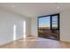 Well lit bedroom featuring hardwood floors and a large view-framing window at 5000 N Camelback Ridge Dr # 301, Scottsdale, AZ 85251