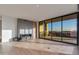 Bright living room features a fireplace and large sliding glass doors to a private balcony with city views at 5000 N Camelback Ridge Dr # 301, Scottsdale, AZ 85251