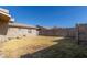 Large backyard with block wall and grassy area at 5331 E Virginia Ave, Phoenix, AZ 85008