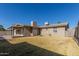 Large backyard with grassy area and covered patio at 5331 E Virginia Ave, Phoenix, AZ 85008