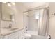 Clean bathroom with white vanity and bathtub shower at 5331 E Virginia Ave, Phoenix, AZ 85008