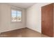 Small bedroom with a window and neutral walls at 5331 E Virginia Ave, Phoenix, AZ 85008