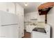 Kitchen with white cabinets and appliances at 5331 E Virginia Ave, Phoenix, AZ 85008