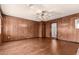 Bright living room featuring wood flooring and wood paneled walls at 5331 E Virginia Ave, Phoenix, AZ 85008