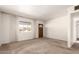 Living room with wood door and window at 5331 E Virginia Ave, Phoenix, AZ 85008