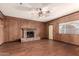 Living room with brick fireplace and wood floors at 5331 E Virginia Ave, Phoenix, AZ 85008