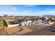 Aerial view of a house with a two-car garage and grassy area at 6105 N 174Th Ave, Waddell, AZ 85355