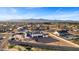 Aerial view of a single-story house with a large backyard and mountain views at 6105 N 174Th Ave, Waddell, AZ 85355