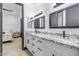 Double vanity bathroom with granite countertop at 6105 N 174Th Ave, Waddell, AZ 85355