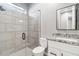 Clean bathroom with tiled shower and granite countertop vanity at 6105 N 174Th Ave, Waddell, AZ 85355