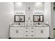 Double vanity bathroom with granite countertops and modern cabinetry at 6105 N 174Th Ave, Waddell, AZ 85355