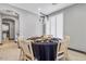 Bright dining room features a round table with seating for four and modern light fixture at 6105 N 174Th Ave, Waddell, AZ 85355