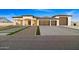 Modern three-car garage home with a spacious driveway at 6105 N 174Th Ave, Waddell, AZ 85355