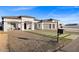 Modern home with three-car garage and landscaped front yard at 6105 N 174Th Ave, Waddell, AZ 85355