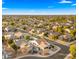 Aerial view of a residential neighborhood with a focus on a single-Gathering home at 6268 S Martingale Ct, Gilbert, AZ 85298