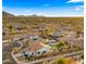 Neighborhood view with a home and pool at 6268 S Martingale Ct, Gilbert, AZ 85298